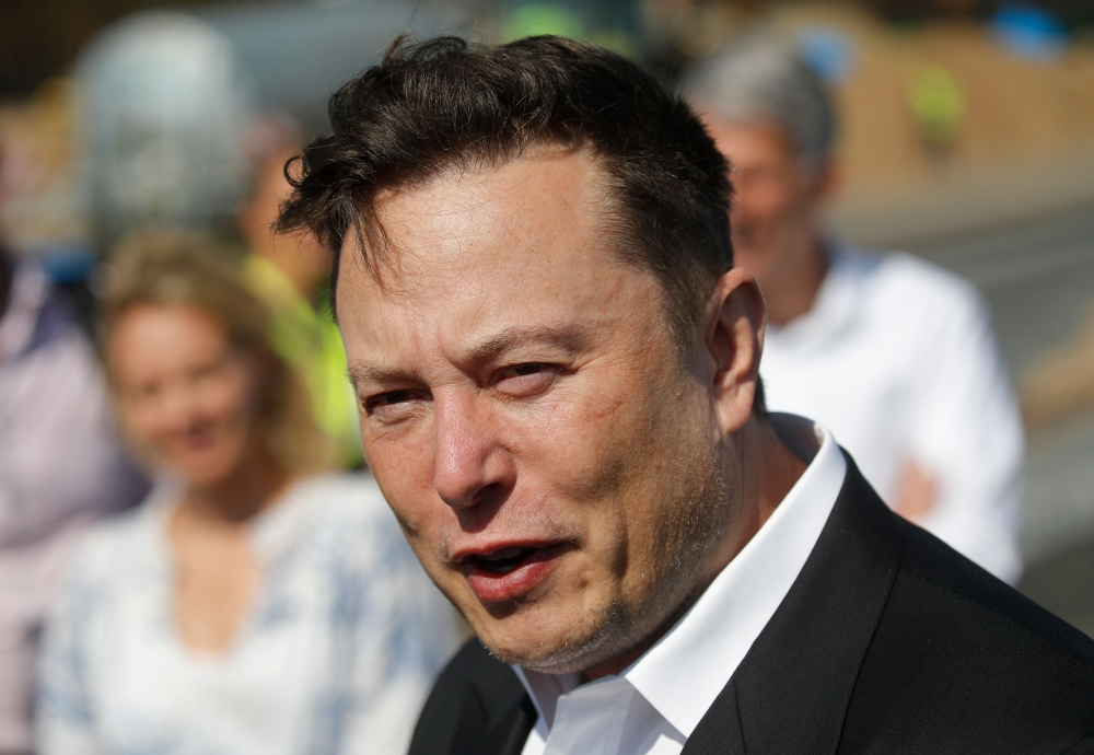Tesla CEO Elon Musk talks to media as he arrives to visit the construction site of the future US electric car giant Tesla, on September 03, 2020 in Gruenheide near Berlin. Tesla builds a compound at the site in Gruenheide in Brandenburg for its first Euro