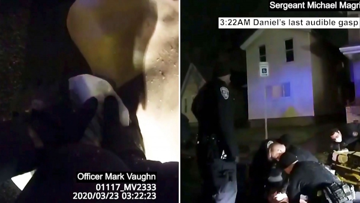 This March 23, 2020, image taken from police bodycam video released by the Rochester, New York, Police Department, shows police holding Daniel Pudre (L) on the ground after allegedly putting a hood over his head./ AFP / Rochester Police Department / 