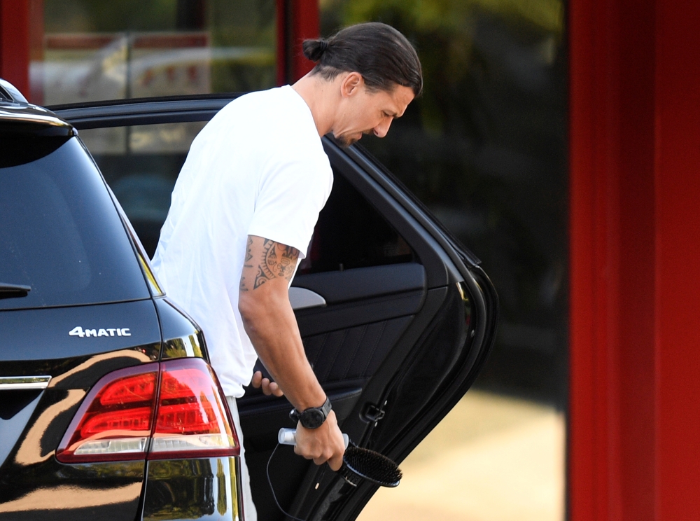 AC Milan's Zlatan Ibrahimovic arrives for training REUTERS/Daniele Mascolo