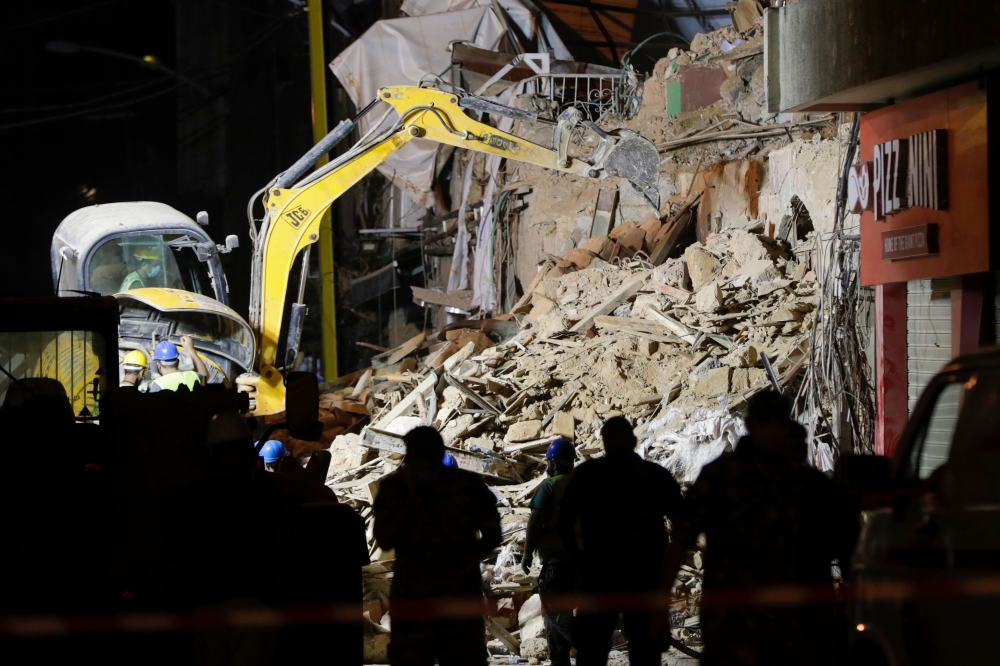 Rescue workers dig through the rubble of a building in the Lebanese capital's Gemmayze area on September 5, 2020.  AFP / ANWAR AMRO