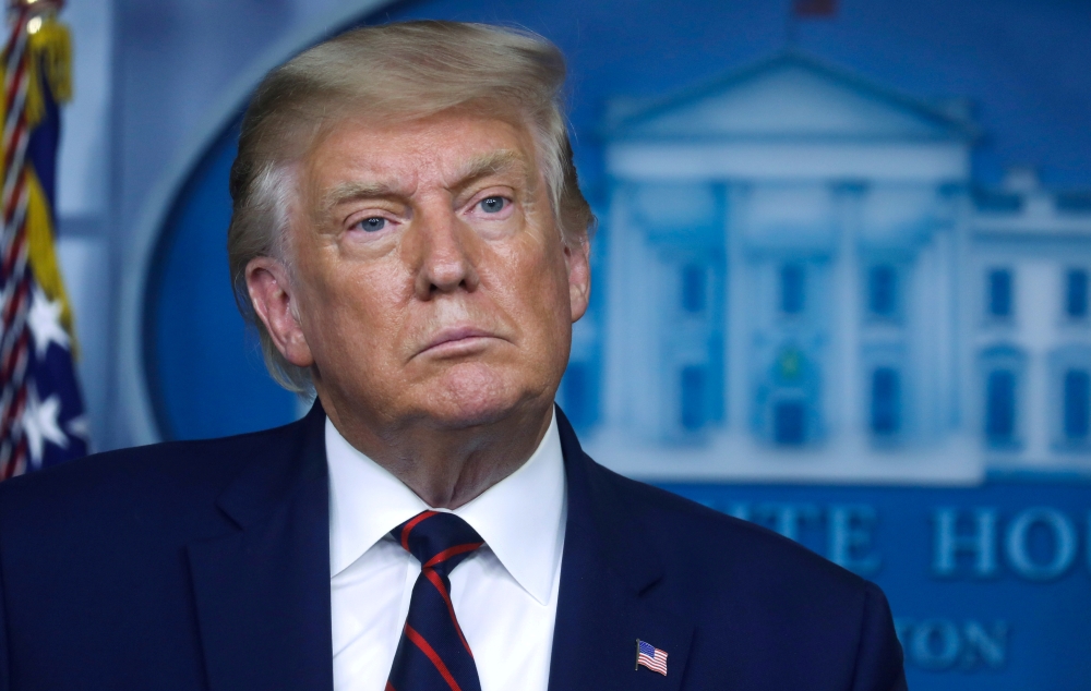 FILE PHOTO: U.S. President Donald Trump listens to a question as he answers reporters questions during a news conference at the White House in Washington, U.S., September 4, 2020. REUTERS/Leah Millis/File Photo