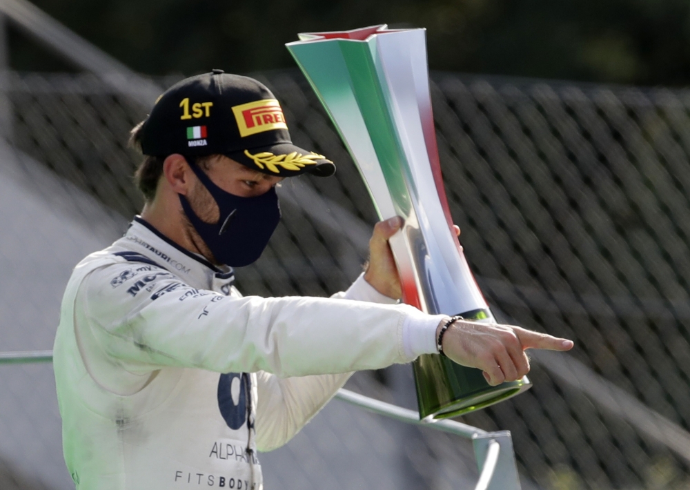  AlphaTauri's Pierre Gasly celebrates winning the Italian Grand Prix on the podium with the trophy Pool via REUTERS/Luca Bruno
