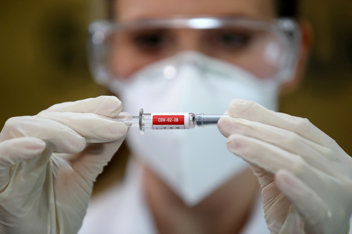 FILE PHOTO: A nurse holds China's Sinovac vaccine, a potential vaccine for the coronavirus disease (COVID-19), at the Sao Lucas Hospital of the Pontifical Catholic University of Rio Grande do Sul (PUCRS), in Porto Alegre, Brazil August 8, 2020. REUTERS/Di