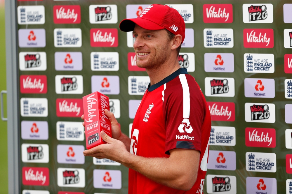 England's Jos Buttler poses with his man of the match award after England's victory in the international Twenty20 cricket match between England and Australia at the Ageas Bowl in Southampton, southern England on September 6, 2020.