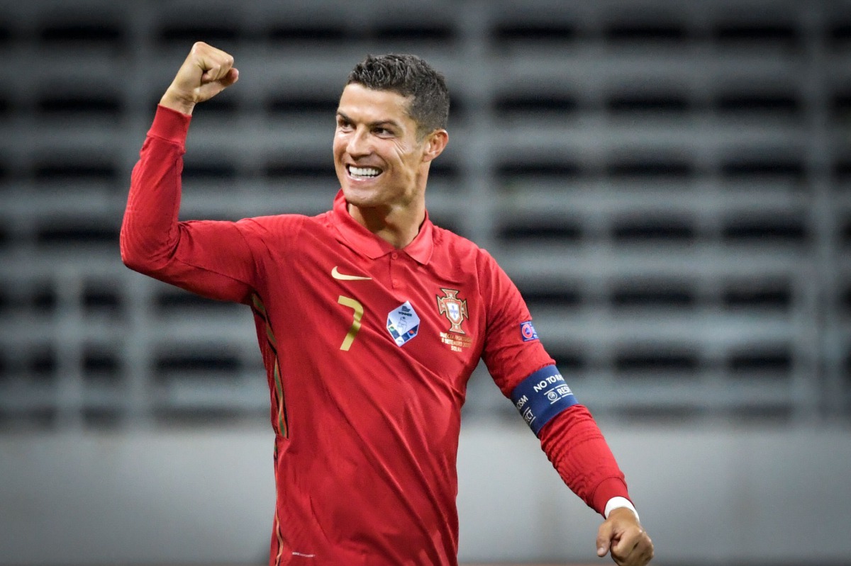 Portugal's forward Cristiano Ronaldo celebrates scoring the opening goal, his 100th goal for Portugal, during the UEFA Nations League football match between Sweden and Portugal on September 8, 2020 in Solna, Sweden. / AFP / TT NEWS AGENCY / Janerik HENRIK