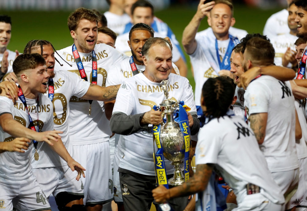 July 22, 2020 Leeds United players and manager Marcelo Bielsa celebrate winning the Championship and promotion to the Premier League, as play resumes behind closed doors following the outbreak of the coronavirus disease (COVID-19) Action Images via Reuter