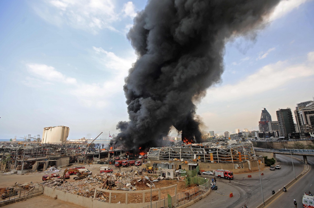 TOPSHOT - Lebanese firefighters try to put out a fire that broke out at Beirut's port area, on September 10, 2020. / AFP / ANWAR AMRO