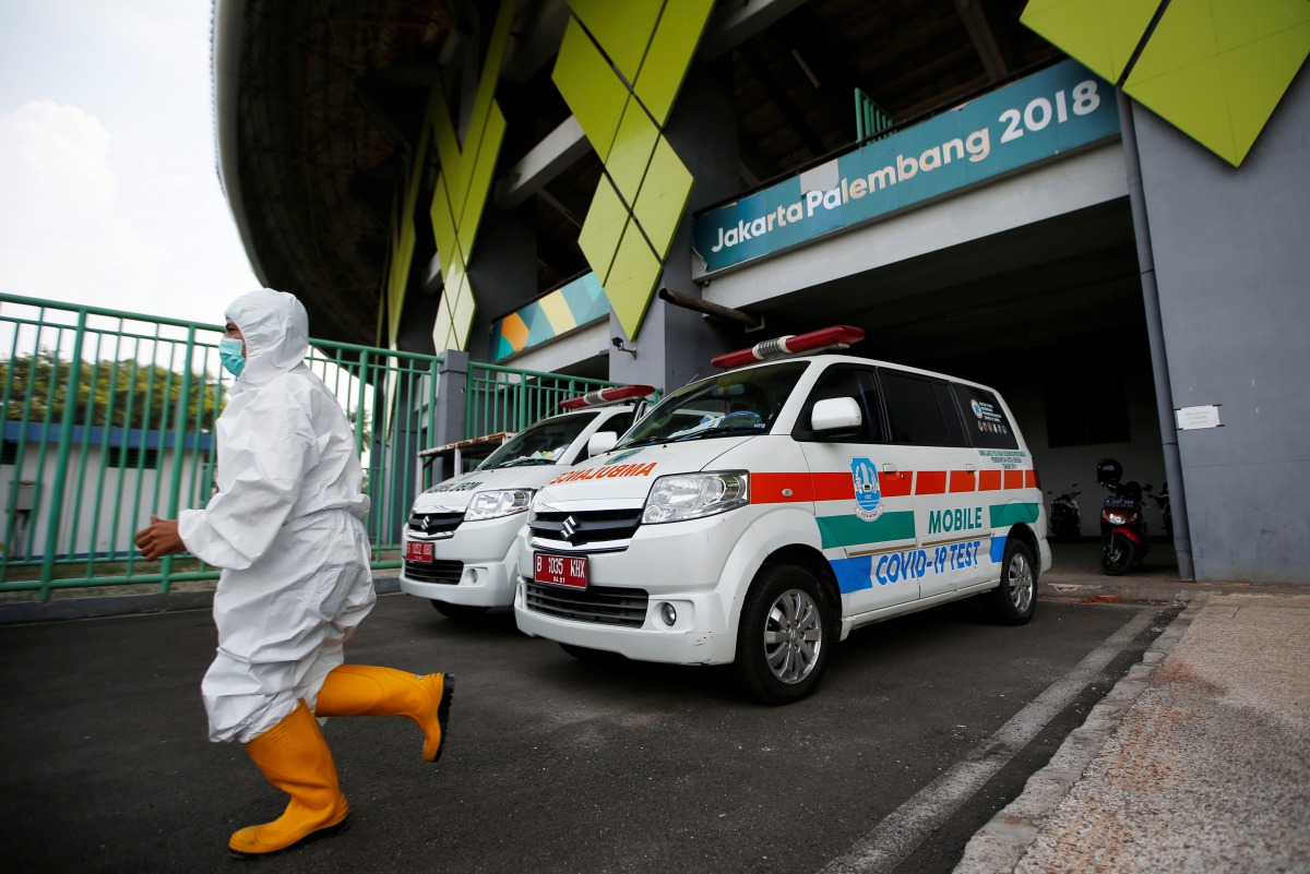 A medical worker wearing a protective suit is pictured at Patriot Candrabhaga Stadium, which is prepared for a coronavirus disease (COVID-19) isolation facility, as an outbreak of the disease continues in Bekasi, on the outskirts of Jakarta, Indonesia, Se