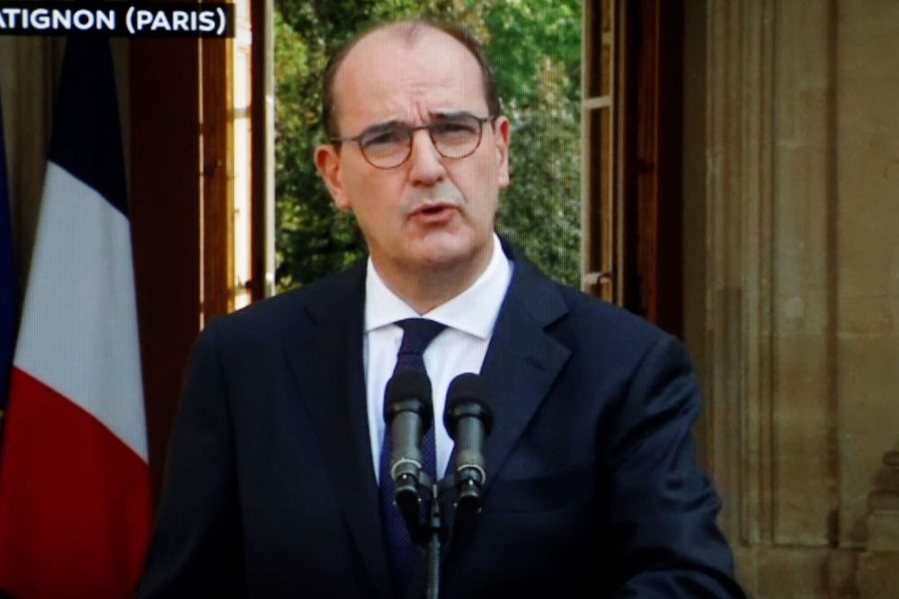 This image of a television screen shows French Prime Minister Jean Castex as he speaks on the coronavirus Covid-19 situation during a press conference at The Hotel Matignon in Paris on September 11, 2020. / AFP / Thomas COEX
