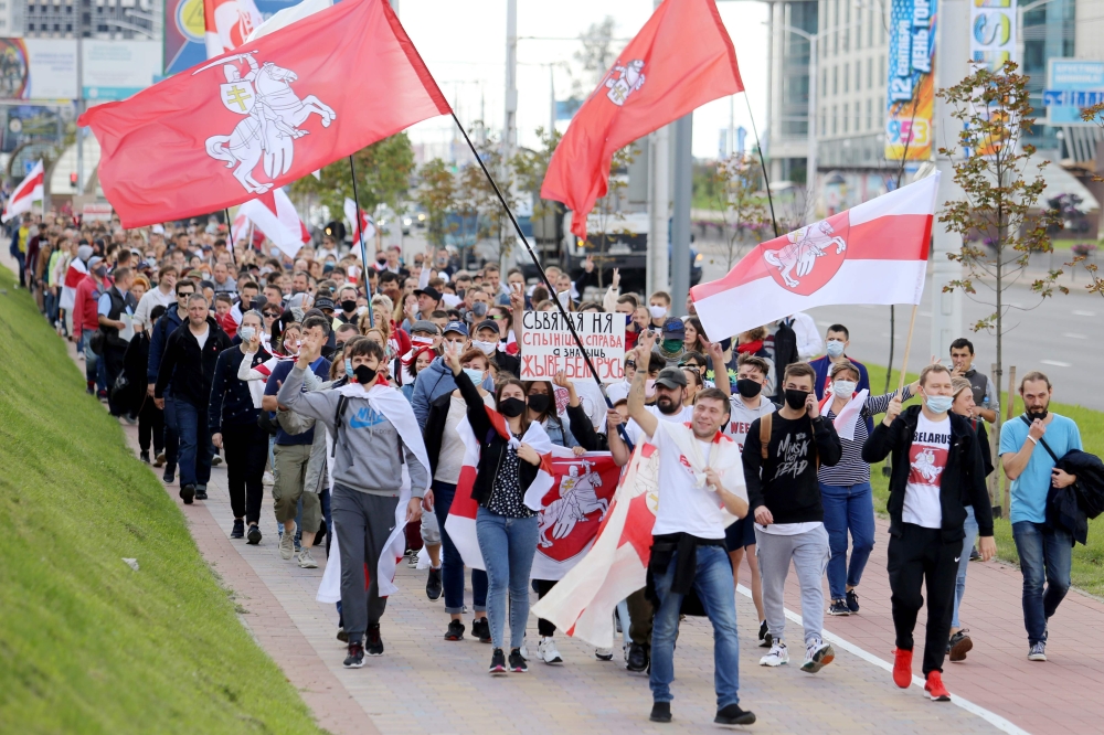 Opposition supporters parade through the streets during a rally to protest against the presidential election results in Minsk on September 13, 2020. AFP / TUT.BY / Vadim Zamirovski