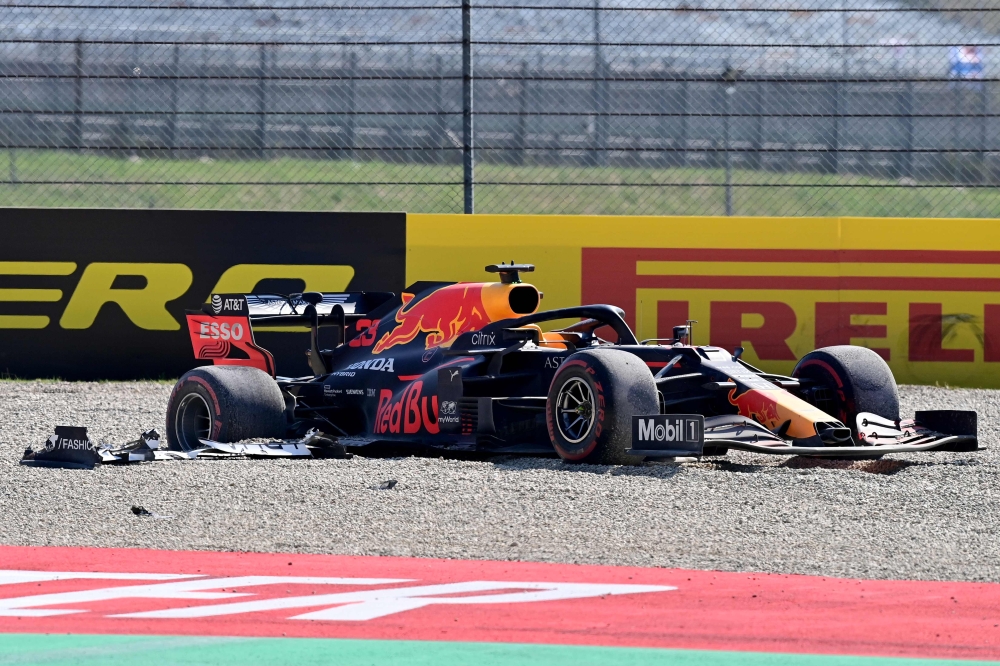 Red Bull's Dutch driver Max Verstappen car in the gravel trap after crashing out of the race during the Tuscany Formula One Grand Prix at the Mugello circuit in Scarperia e San Piero on September 13, 2020. / AFP / POOL / MIGUEL MEDINA