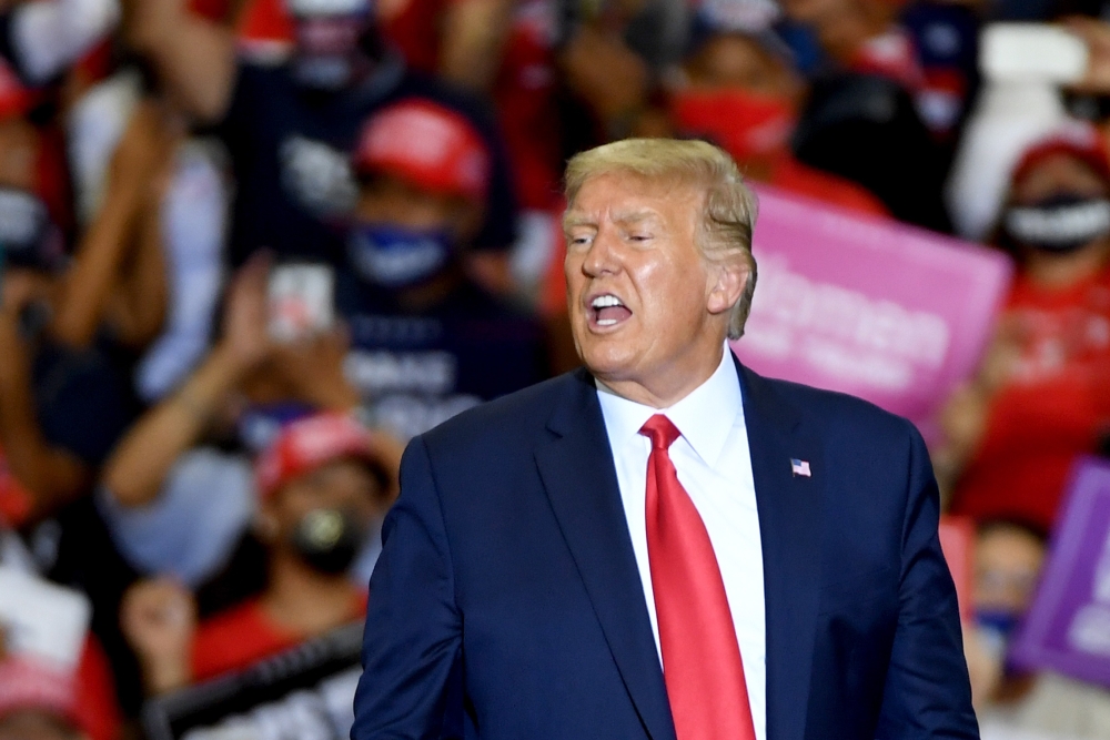 US President Donald Trump leaves the stage after speaking at a campaign event at Xtreme Manufacturing on September 13, 2020 in Henderson, Nevada. Ethan Miller/Getty Images/AFP 