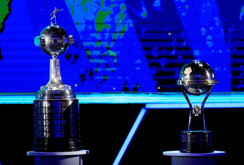 The trophies of the Copa Libertadores and the Copa Sudamericana REUTERS/Jorge Adorno/File Photo