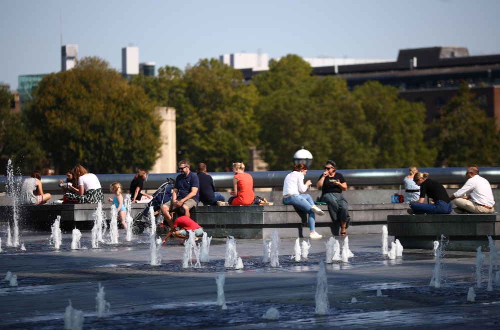 People eat during lunchtime, as the spread of coronavirus disease (COVID-19) continues, in London, Britain September 14, 2020. REUTERS/Hannah McKay