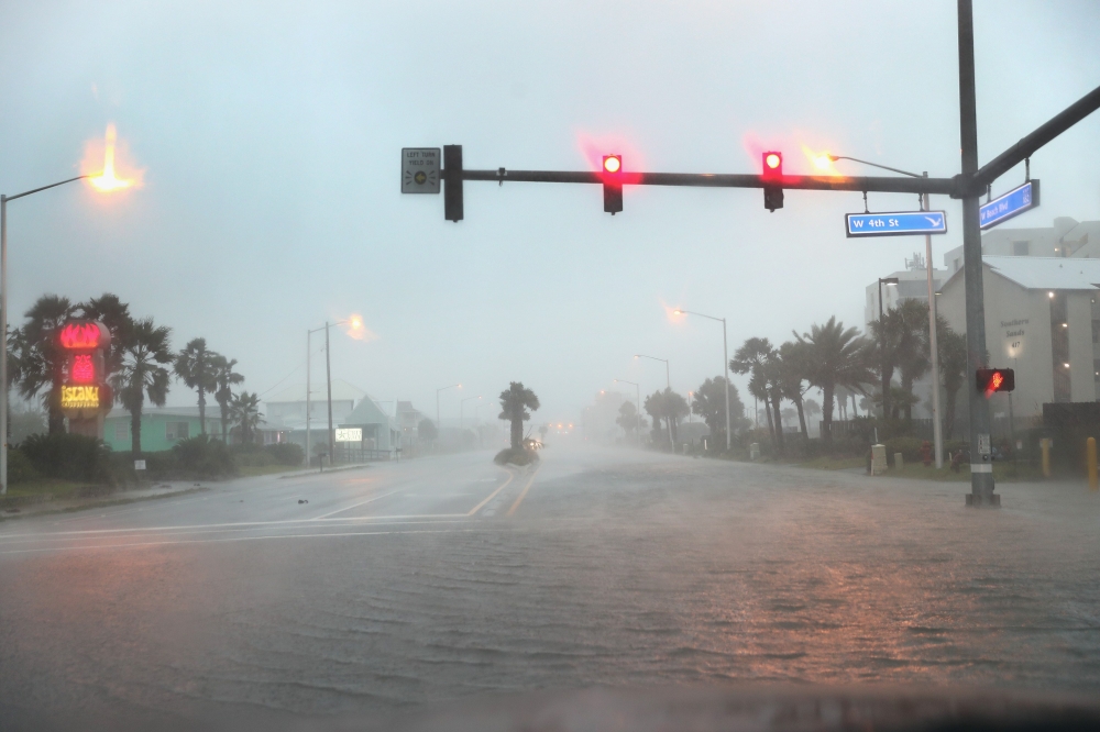 SEPTEMBER 15: Water floods a road as the outer bands of Hurricane Sally come ashore on September 15, 2020 in Gulf Shores, Alabama. The storm is bringing heavy rain, high winds and a dangerous storm surge from Louisiana to Florida. Joe Raedle/Getty Images/