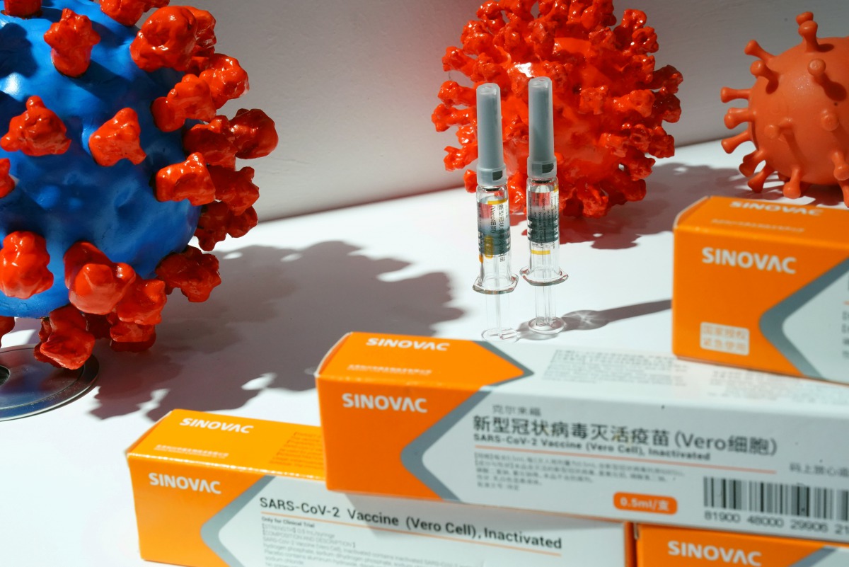 FILE PHOTO: A booth displaying a coronavirus vaccine candidate from Sinovac Biotech Ltd is seen at the 2020 China International Fair for Trade in Services (CIFTIS), following the COVID-19 outbreak, in Beijing, China September 4, 2020. REUTERS/Tingshu Wang