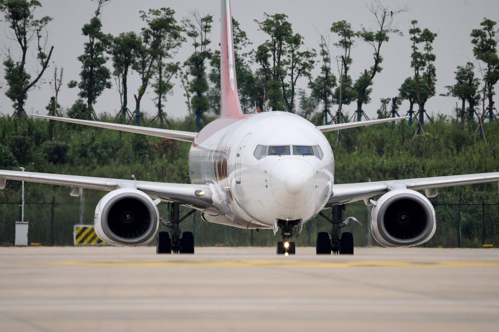In this photo taken on September 16, 2020, a Boeing 737-800 operated by South Korean carrier T'way taxis after landing at Wuhan's Tianhe International Airport in China's central Hubei province. China's Wuhan, ground zero for the coronavirus outbreak which