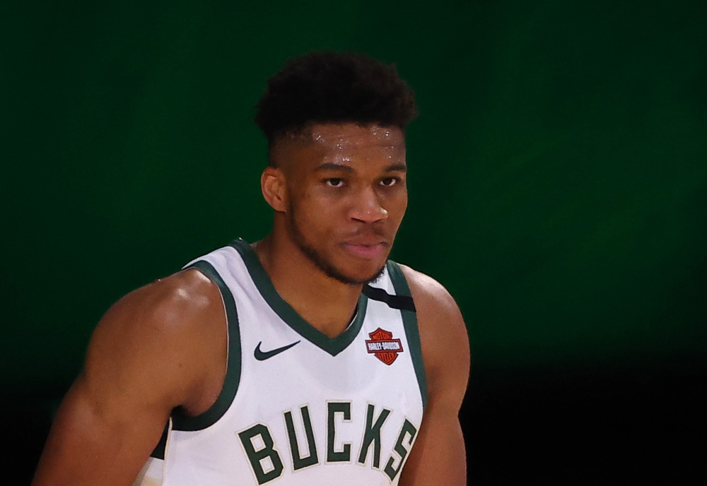 In this file photo taken on August 28, 2020 Giannis Antetokounmpo #34 of the Milwaukee Bucks looks on against the Orlando Magic during the third quarter in Game Five of the Eastern Conference First Round during the 2020 NBA Playoffs at AdventHealth Arena 