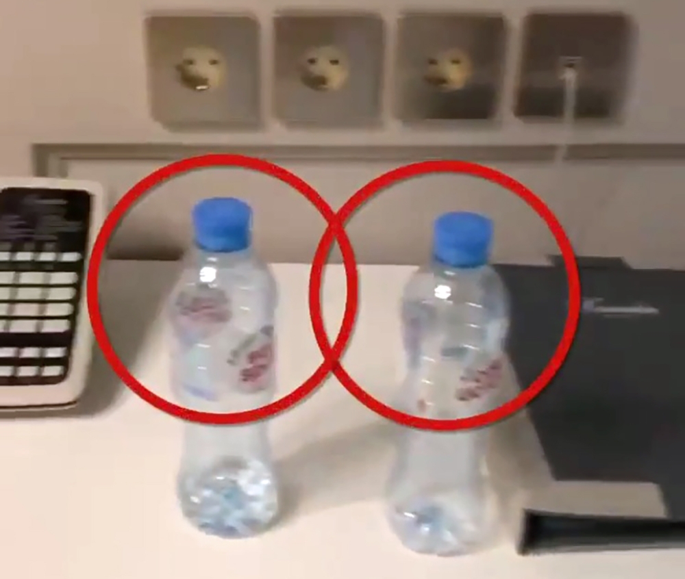This grab taken from a video posted on September 17, 2020 on the Instagram account of @navalny shows bottles of Svyatoi Istochnik, or Holy Spring, mineral water, in the hotel room where opposition leader Alexei Navalny stayed during his visit to the Siber