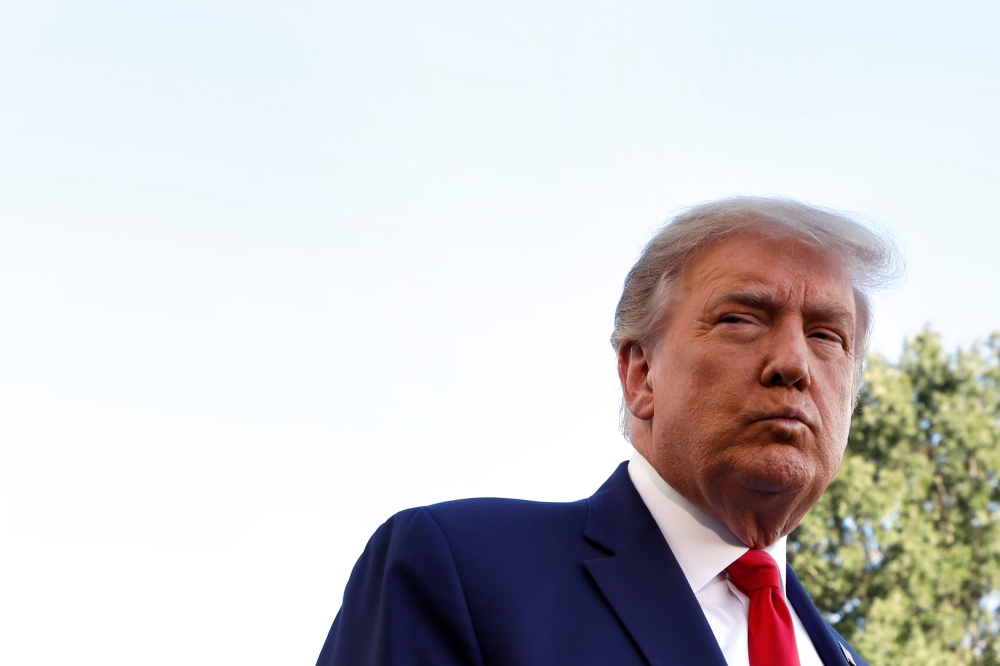 US President Donald Trump speaks to the media on the South Lawn of the White House in Washington, before his departure on campaign travel to Fayetteville, North Carolina, U.S., September 19, 2020. REUTERS/Yuri Gripas