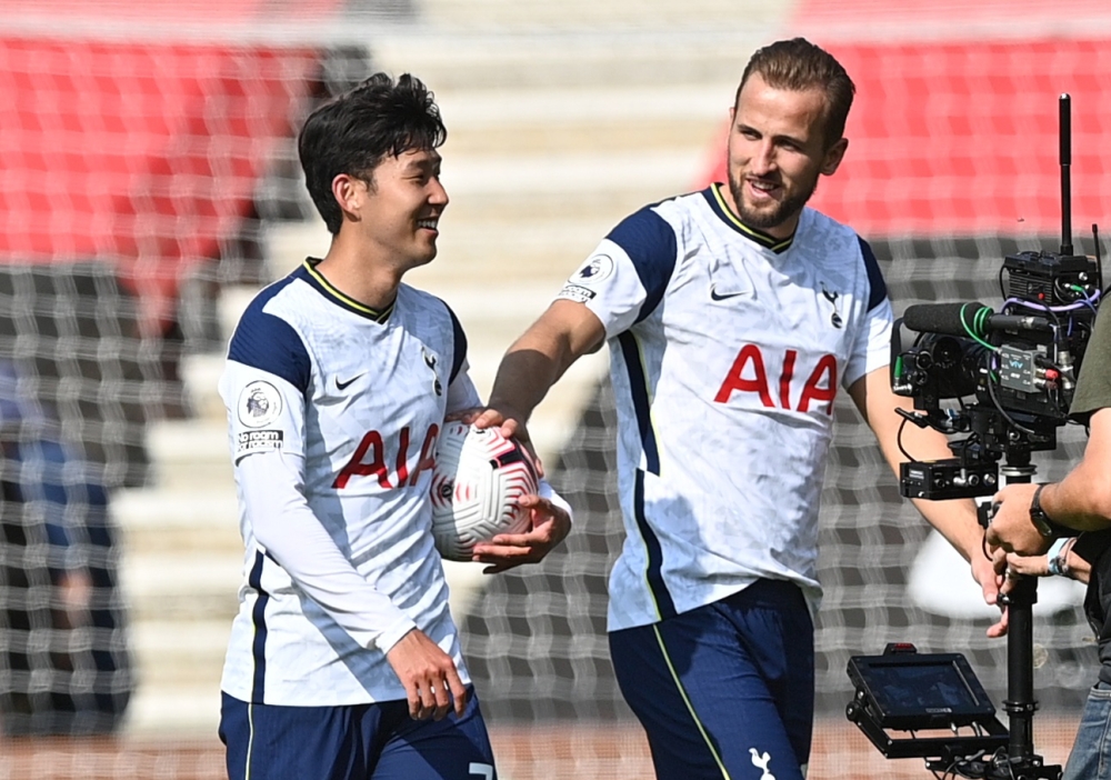 Tottenham Hotspur's Son Heung-min celebrates with the match ball and Harry Kane after the match. REUTERS/Justin Tallis 