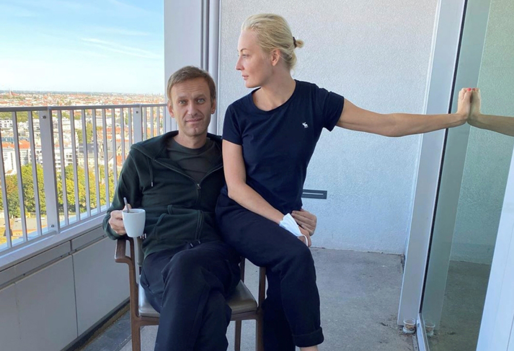 Russian opposition politician Alexei Navalny and his wife Yulia Navalnaya pose for a picture at Charite hospital in Berlin, Germany, in this undated image obtained from social media September 21, 2020.