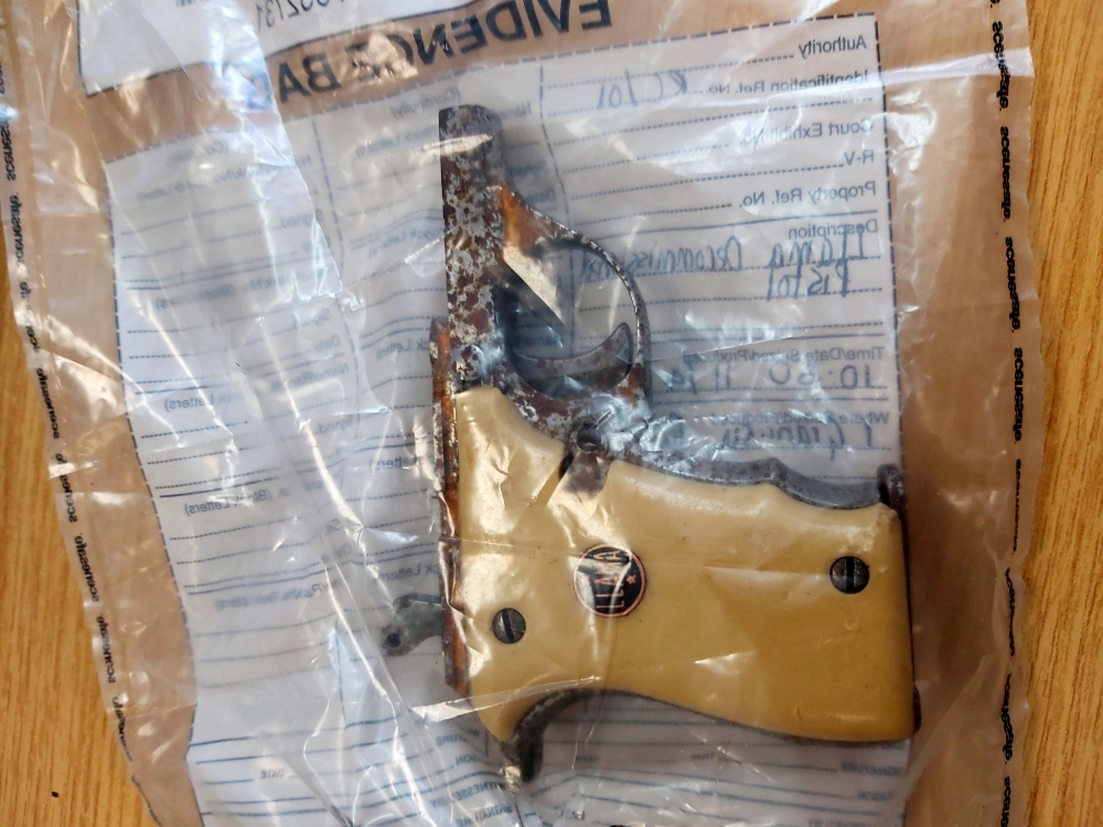 A handout photograph released by the Metropolitan Police in London on September 21, 2020, shows a yellow-handed Llama pistol, which featured in James Bond 007 movie 