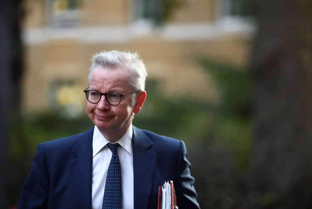Britain's Chancellor of the Duchy of Lancaster Michael Gove walks outside Downing Street in London, Britain, September 22, 2020. REUTERS/Hannah McKay