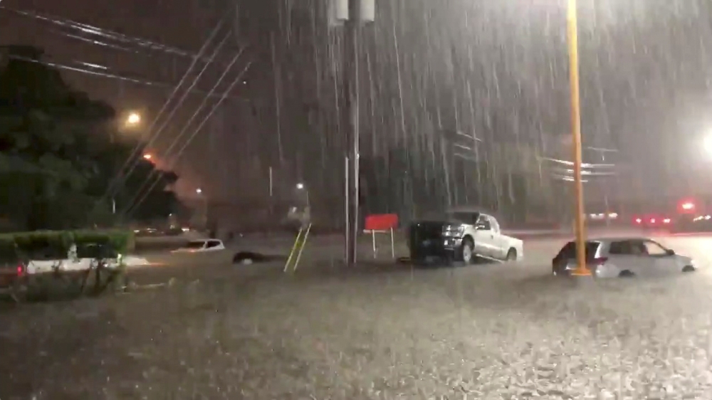 Vehicles are seen in an area affected by flood due to Tropical Storm Beta in Houston, Texas, September 21, 2020, in this still image from video obtained via social media. Video taken September 21, 2020. @PastorJaimeG via REUTERS