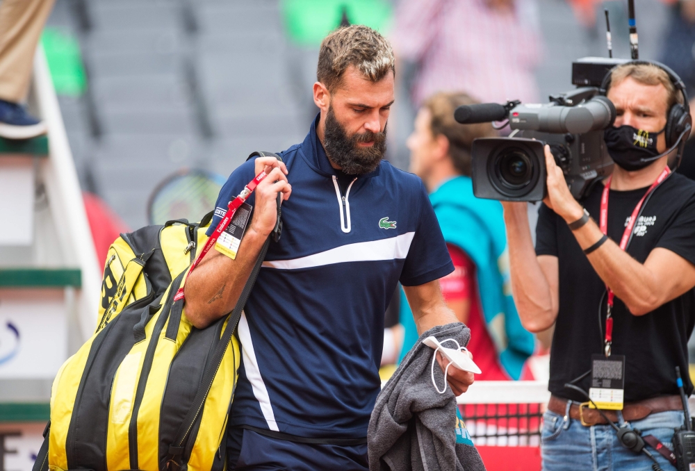 Benoit Paire of France leaves the court after he gave up in the second set his first round match against Casper Ruud of Norway during the ATP-Tour German Open tennis tournament at the stadium Am Rothenbaum in Hamburg, northern Germany, on September 23, 20