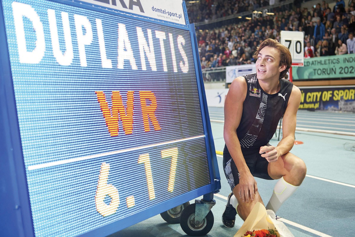 Armand Duplantis celebrates next to the board after he broke world pole vault record of 6.17 metres at the Orlen Copernicus Cup 2020 World Athletics Indoor meeting.