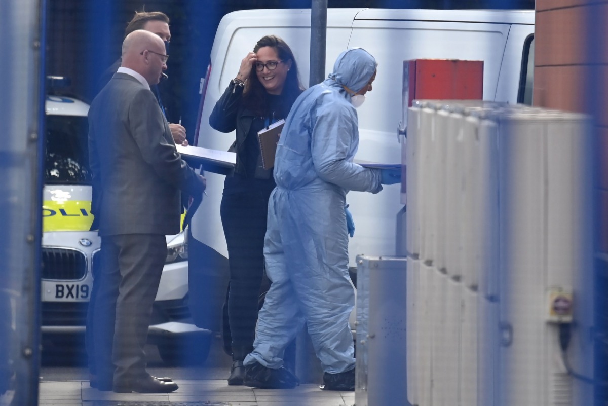 A forensic team is pictured at the Croydon Custody Centre in south london on September 25, 2020, following the shooting of a British police officer by a 23-year-old man being detained at the centre. A British police officer was shot dead in the early hour