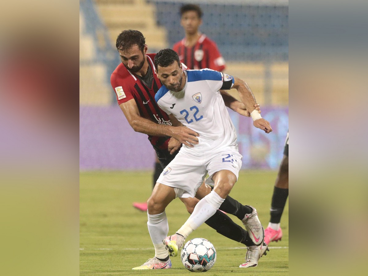 Players vie for the ball during the Ooredoo Cup Group B Round 1 match between Al Kharaitiyat and Al Rayyan yesterday.