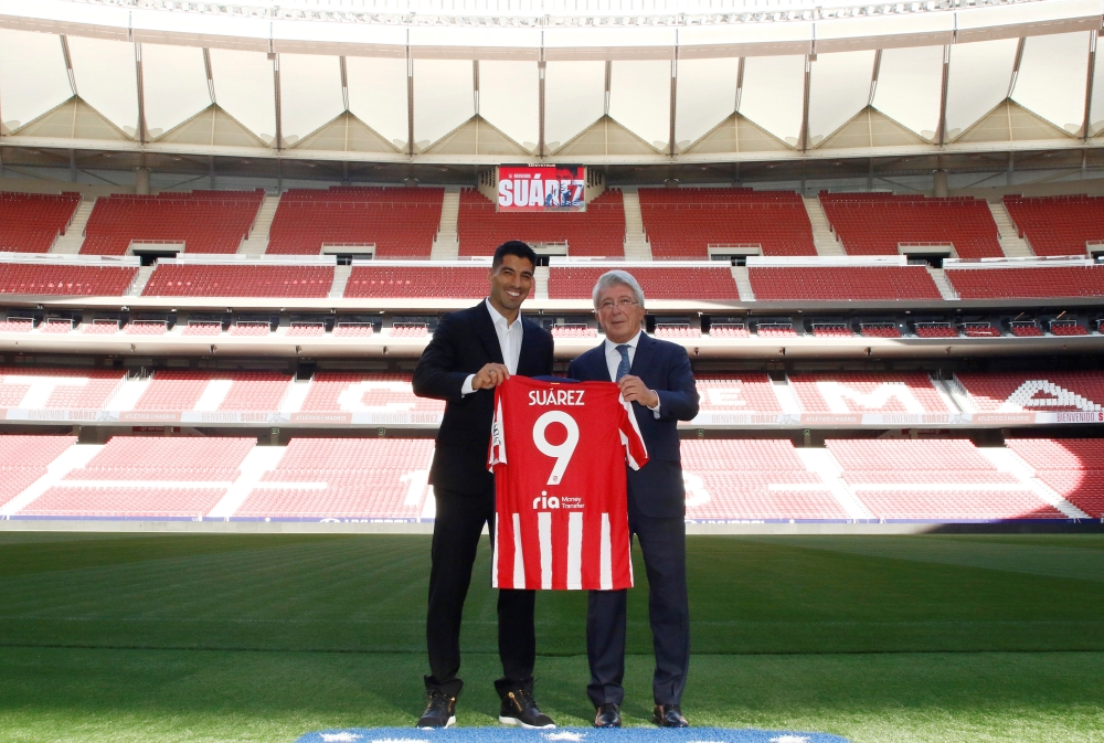 Luis Suarez after signing for Atletico Madrid with president Enrique Cerezo ClubAtleticoMadrid