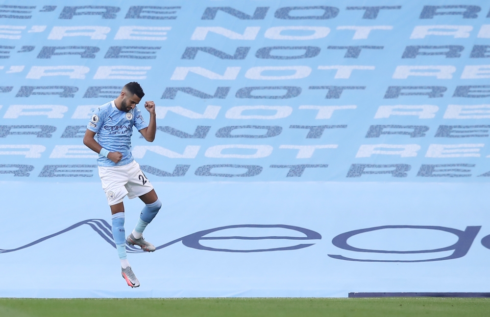 Manchester City's Riyad Mahrez celebrates scoring their first goal Pool via REUTERS/Martin Rickett 