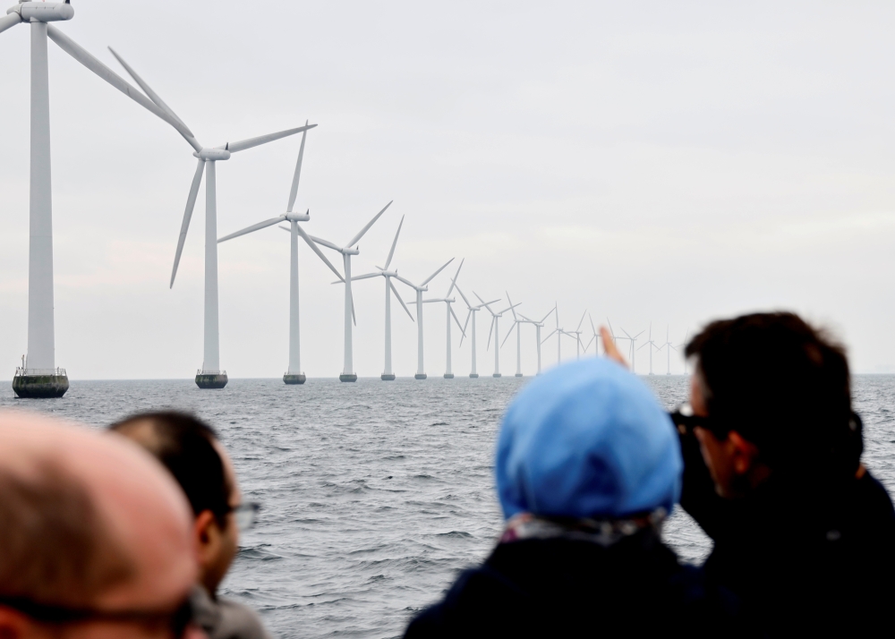 FILE PHOTO: Middelgrunden offshore wind farm is pictured, outside Copenhagen, Denmark November 27, 2019. Picture taken November 27, 2019. REUTERS/Andreas Mortensen/File Photo
