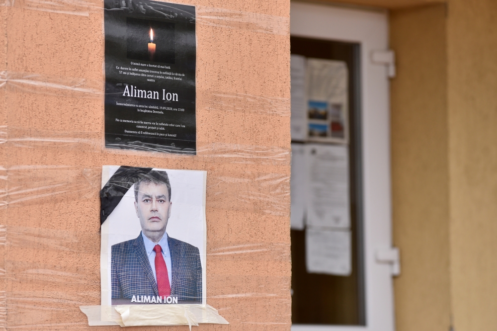 An obituary photo of former mayor Aliman Ion is taped onto the walls of the city hall in Deveselu, southern Romania, September 28, 2020. Inquam Photos/Bogdan Danescu via REUTERS 