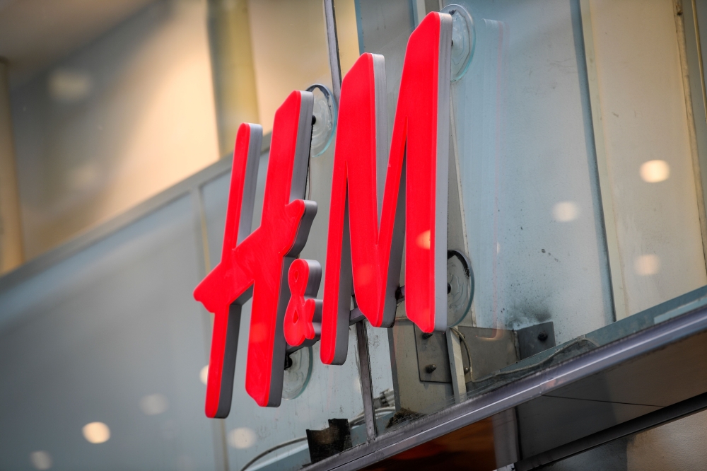 (FILES) This file photograph taken on April 2, 2020, shows the logo of H & M (Hennes & Mauritz AB) at a company store in central Stockholm. AFP / TT News Agency / Fredrik Sandberg 