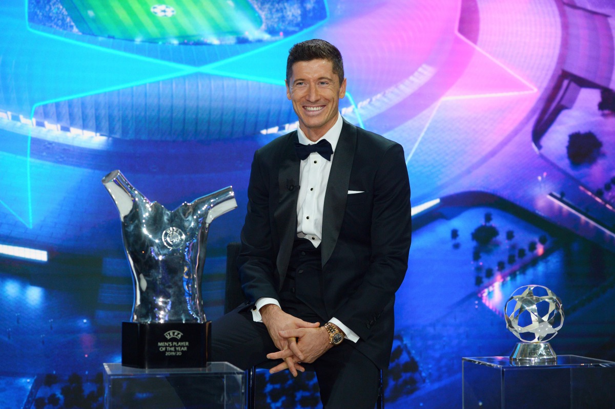 This handout picture taken and released by UEFA on October 1, 2020, shows Bayern Munich's Polish forward Robert Lewandowski poses after receiving the season 2019/2020 player of the year award during the UEFA Champions League group stage draw at the RTS st