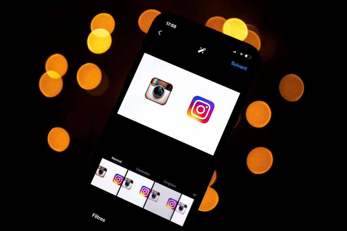 This picture taken on September 28, 2020 shows the logo of the social network Instagram on a smartphone, in Toulouse, southwestern France. The Instagram group will, in early October 2020, celebrate its ten-year anniversary. / AFP / Lionel BONAVENTURE
