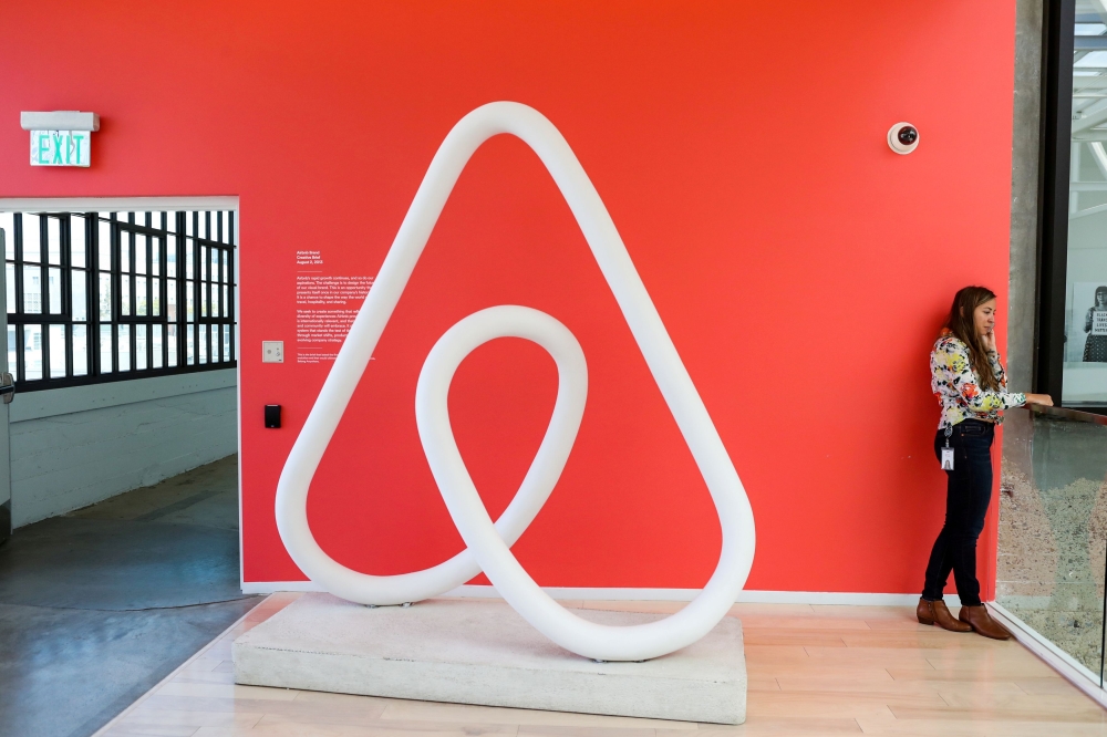 A woman talks on the phone at the Airbnb office headquarters in the SOMA district of San Francisco, California, U.S., August 2, 2016. REUTERS/Gabrielle Lurie/File Photo