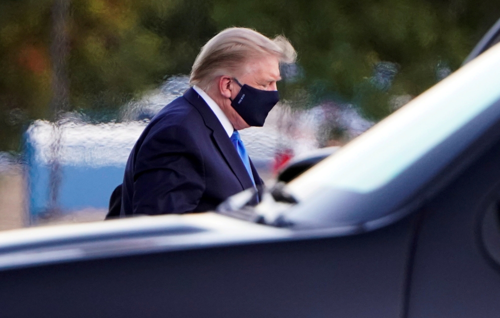 US President Donald Trump arrives at Walter Reed National Military Medical Center by helicopter after the White House announced that he 