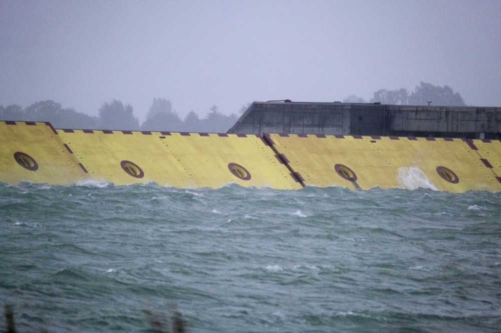 Mose flood barrier scheme is used for the first time, in Venice, Italy, October 3, 2020. REUTERS/Manuel Silvestri