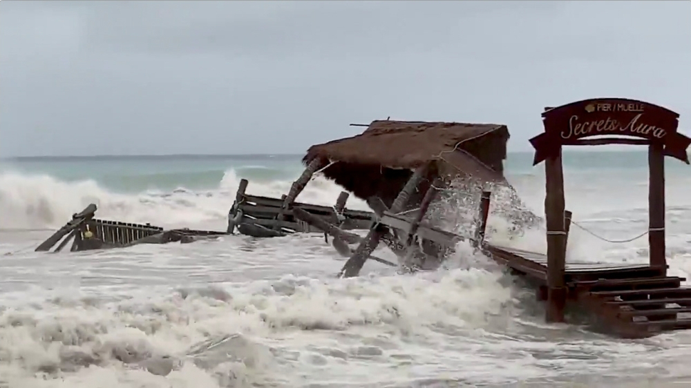 A pier is washed away by Tropical Storm Gamma in Cozumel, Mexico, October 3, 2020, in this still image from video obtained via social media. @THE_KLUTE via REUTERS