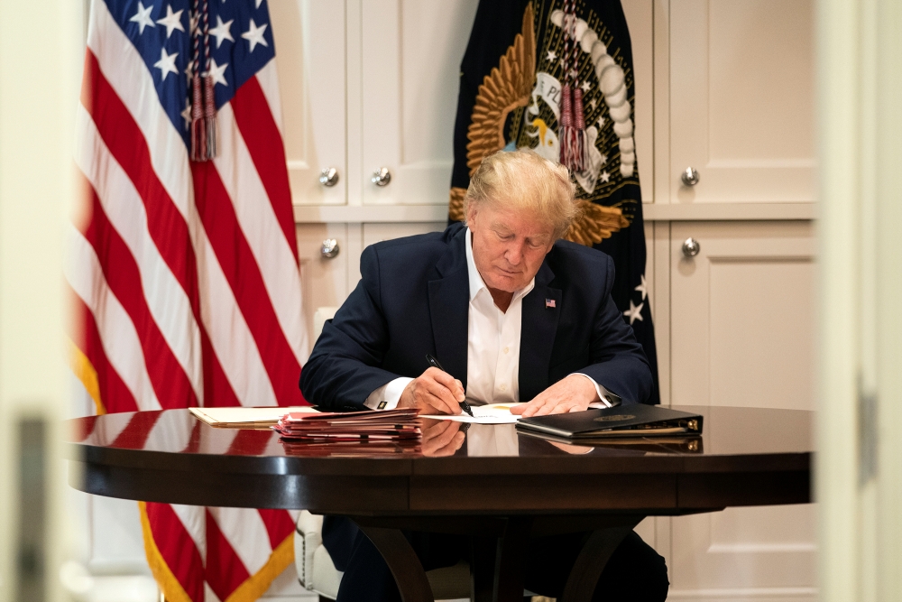 US President Donald Trump works in the Presidential Suite while receiving treatment after testing positive for the coronavirus disease (COVID-19) at Walter Reed National Military Medical Center in Bethesda, Maryland, U.S. October 3, 2020. Joyce N. Boghosi