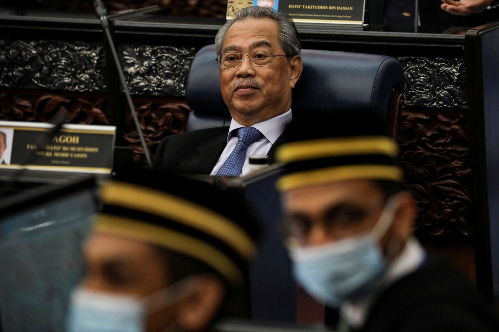 Malaysia's Prime Minister Muhyiddin Yassin reacts during a session of the lower house of parliament, in Kuala Lumpur, Malaysia July 13, 2020. REUTERS/Lim Huey Teng/File Photo
