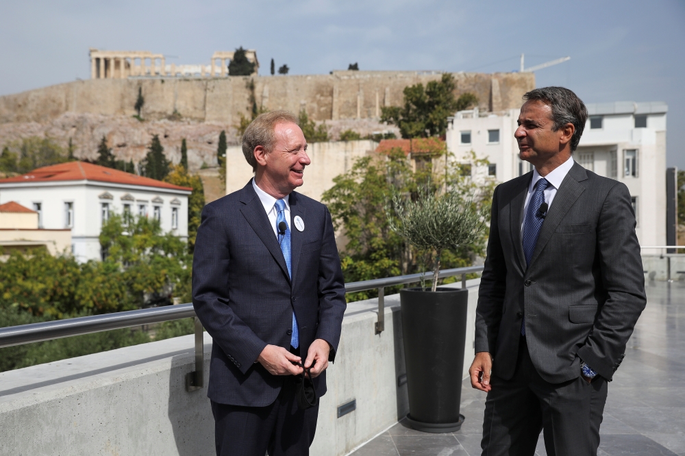 President of Microsoft Brad Smith speaks with Greek Prime Minister Kyriakos Mitsotakis, with the ancient Acropolis hill in the background, during an event on the company's new investment in Greece, at the Acropolis Museum in Athens, Greece October 5, 2020