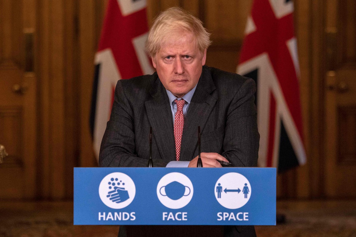 Britain's Prime Minister Boris Johnson attends a remote press conference to update the nation on the COVID-19 pandemic, inside 10 Downing Street in central London on September 30, 2020, the 100th coronavirus briefing since the pandemic hit the UK. / AFP /