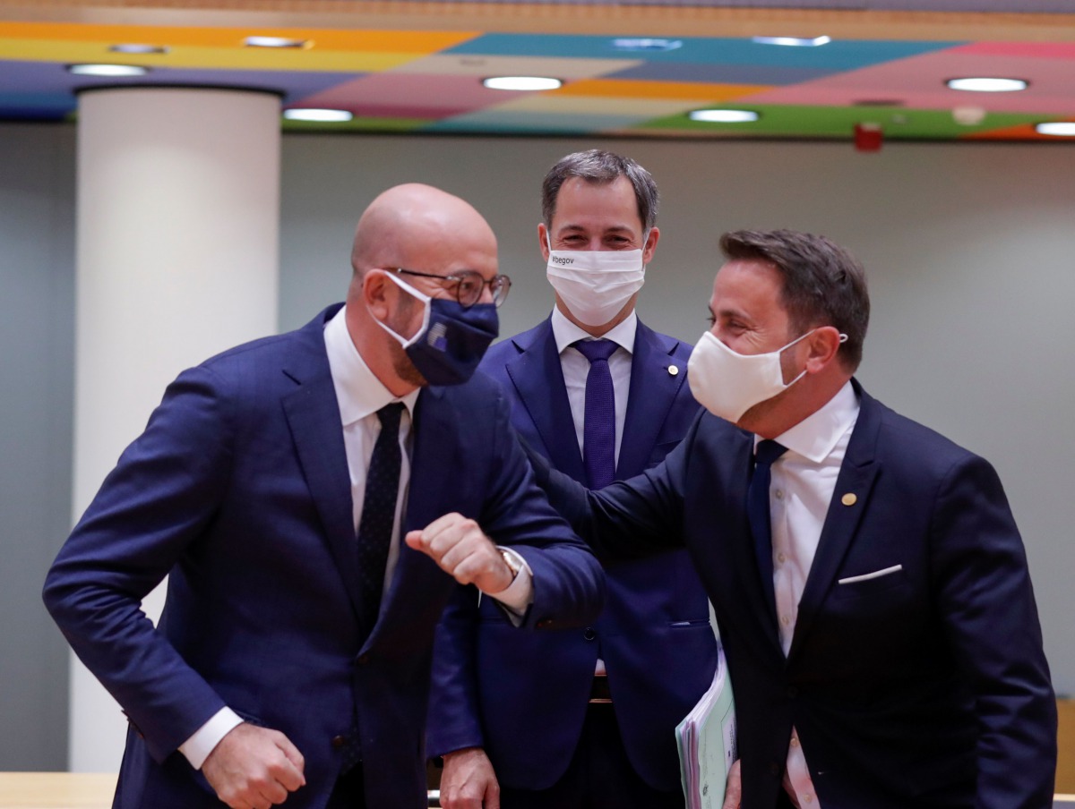 Belgium's Prime Minister Alexander De Croo, European Council President Charles Michel and Luxembourg's Prime Minister Xavier Bettel react at the start of the second face-to-face European Union summit since the coronavirus disease (COVID-19) outbreak, in B