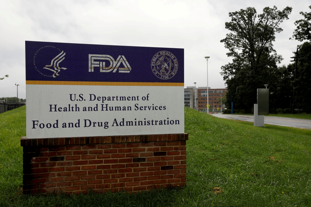 Signage is seen outside of the U.S. Food and Drug Administration (FDA) headquarters in White Oak, Maryland, U.S., August 29, 2020. REUTERS/Andrew Kelly/File Photo